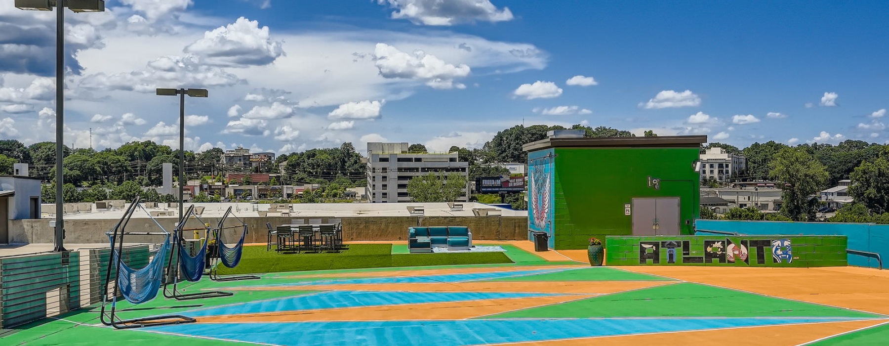 a colorful rooftop area with hammocks