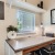 a desk in a bedroom with a window