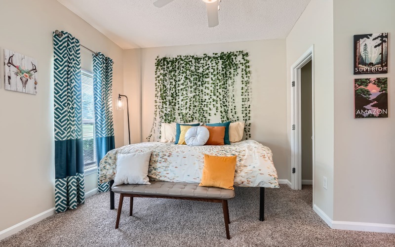 a bedroom with a bed and a window