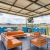 a grill area with a couch and a tv