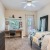 carpeted bedroom with ample lighting